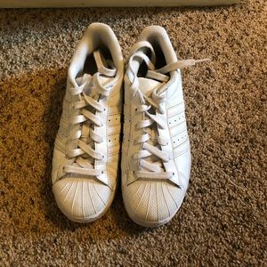 All white Adidas Superstar